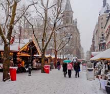 Snow falls on the Luxembourg Christmas market. // © 2011 Pride Travel / Nathan DePetris S